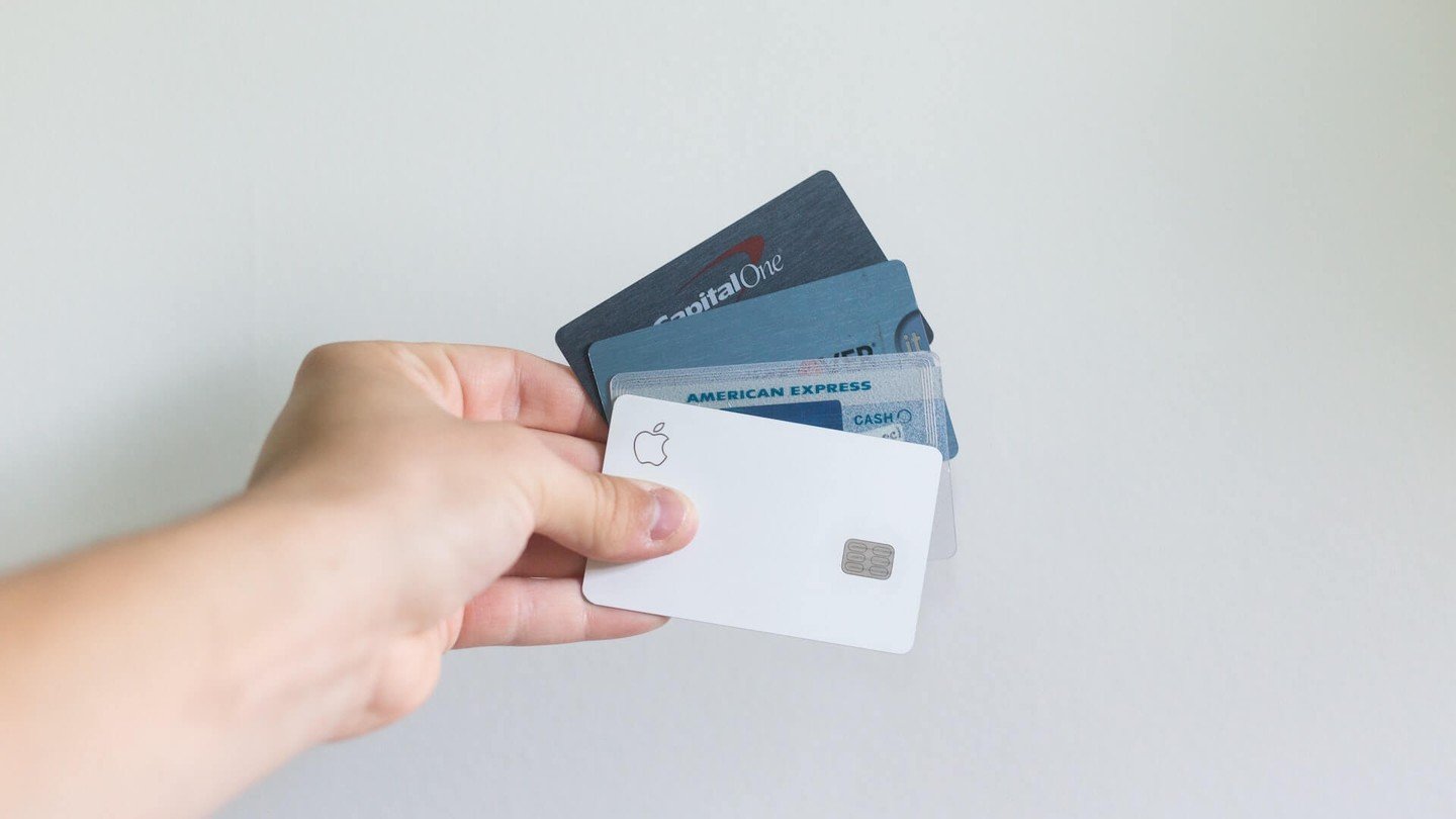 Hand holding multiple credit cards Hand holding multiple credit cards
