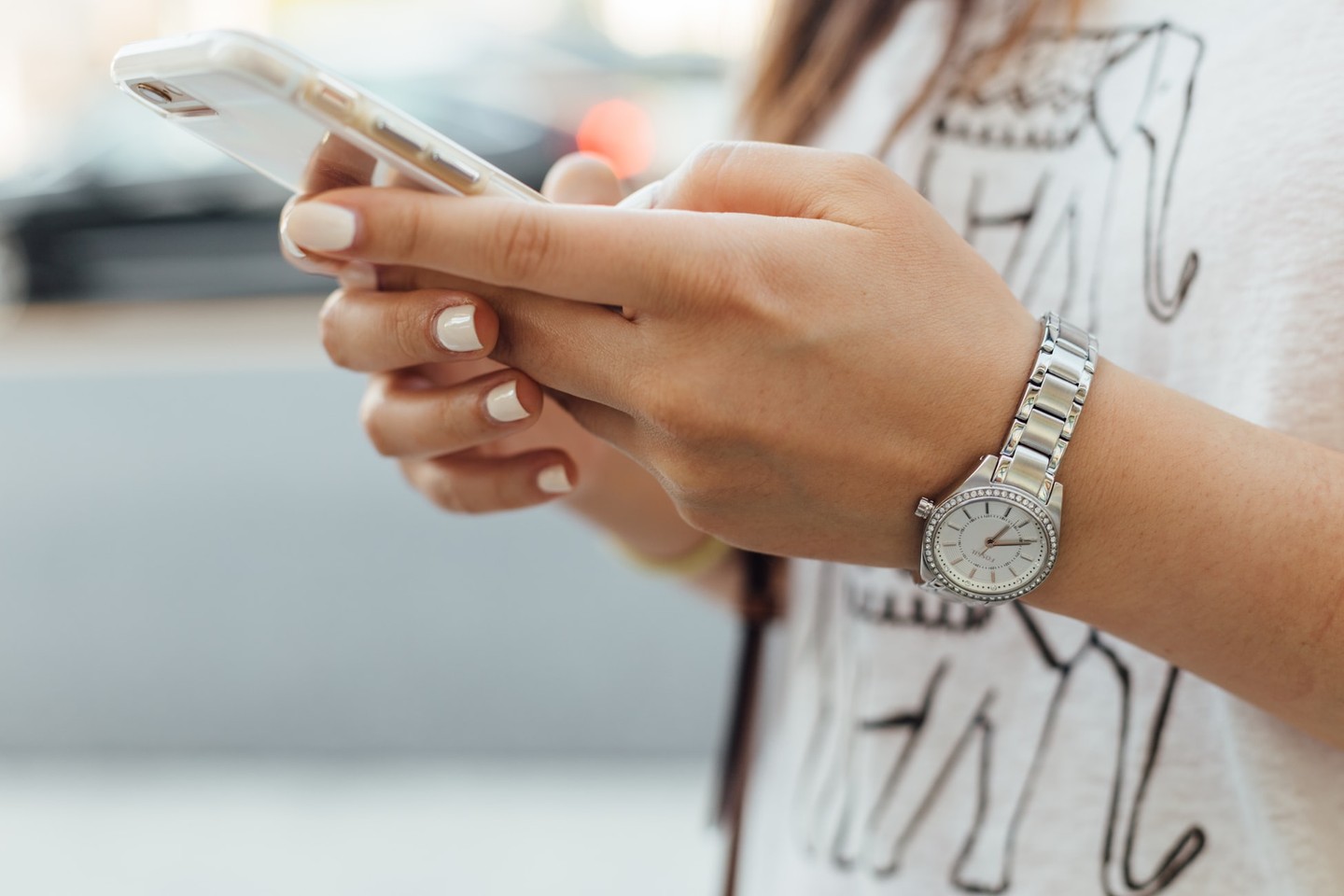 Woman holding phone Woman holding phone