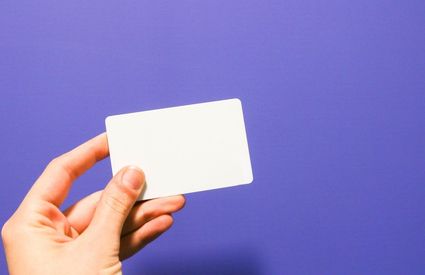 Someone holding a blank credit card