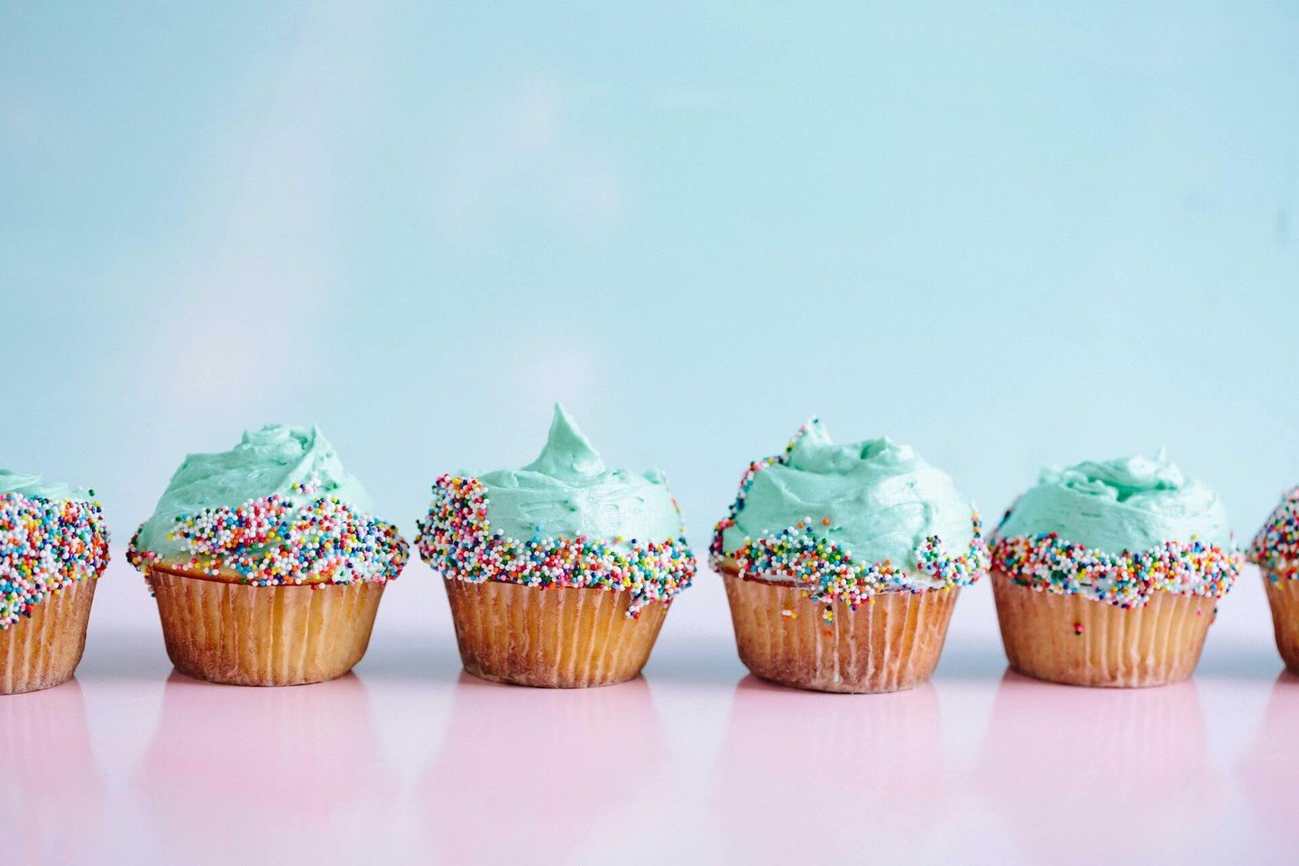 A row of iced cupcakes A row of iced cupcakes