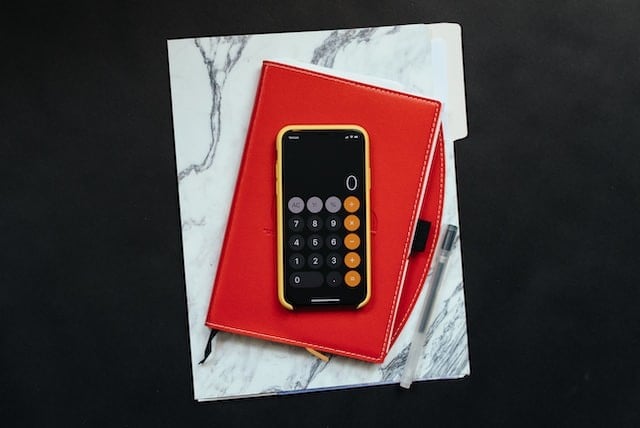iPhone calculator on top of notebooks