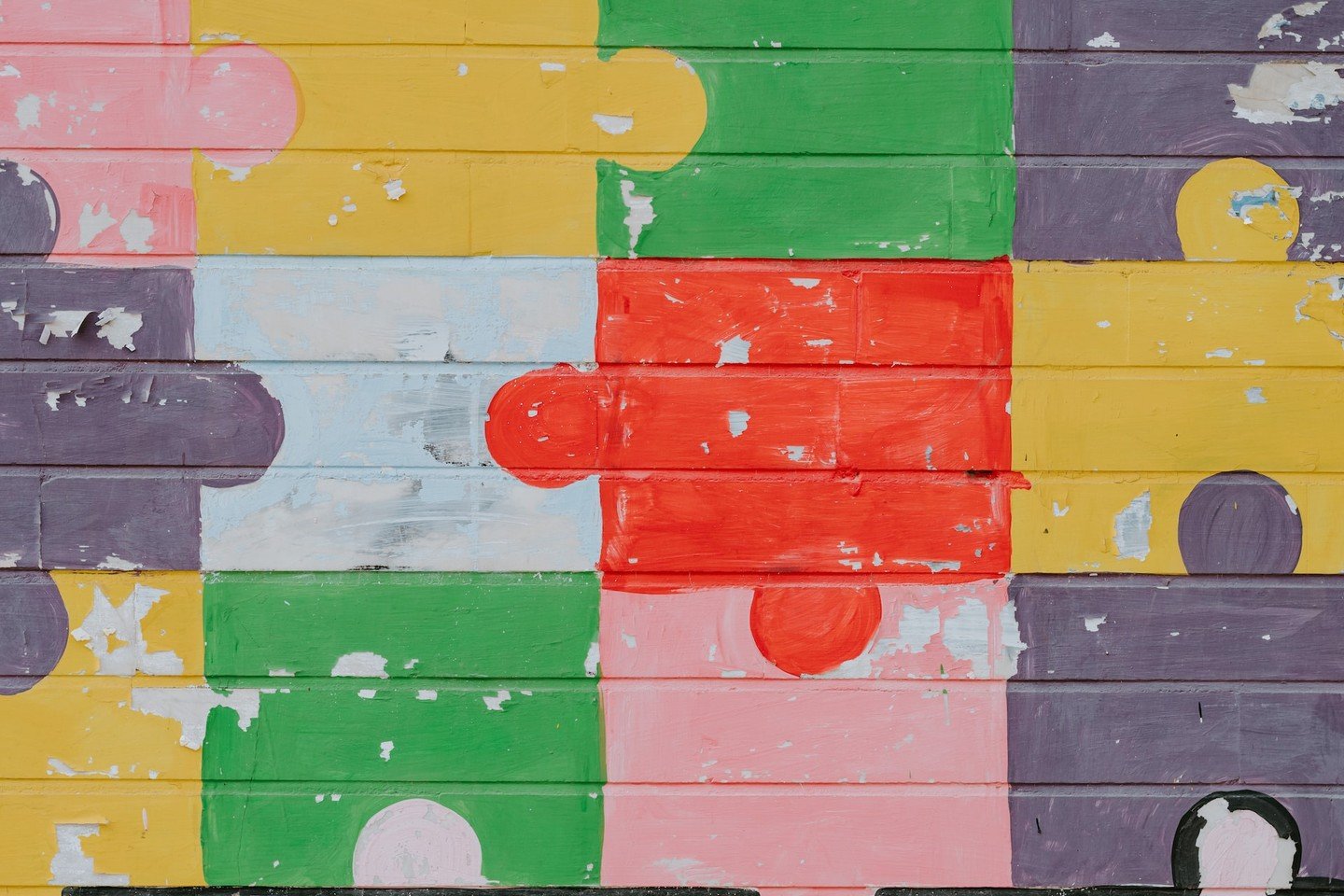 Puzzle pieces painted on a wall Puzzle pieces painted on a wall