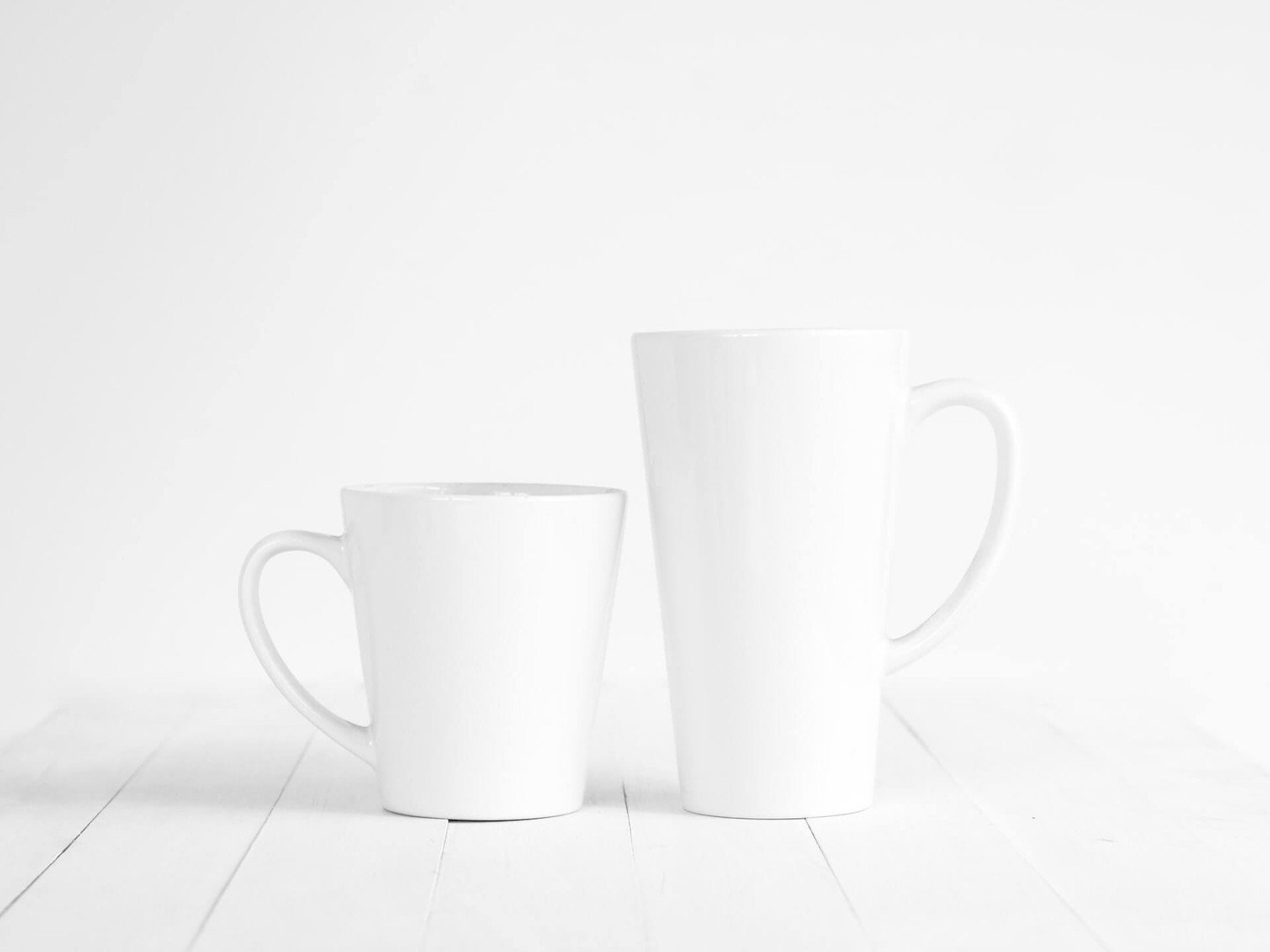 Two different size white cups