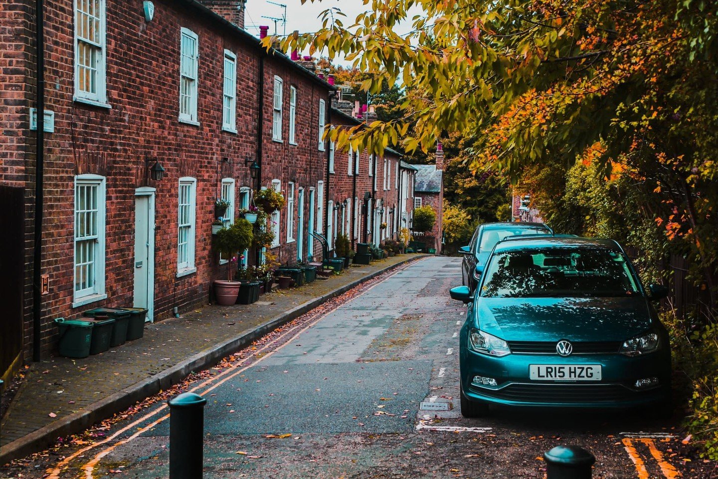 Terraced houses on road with cars