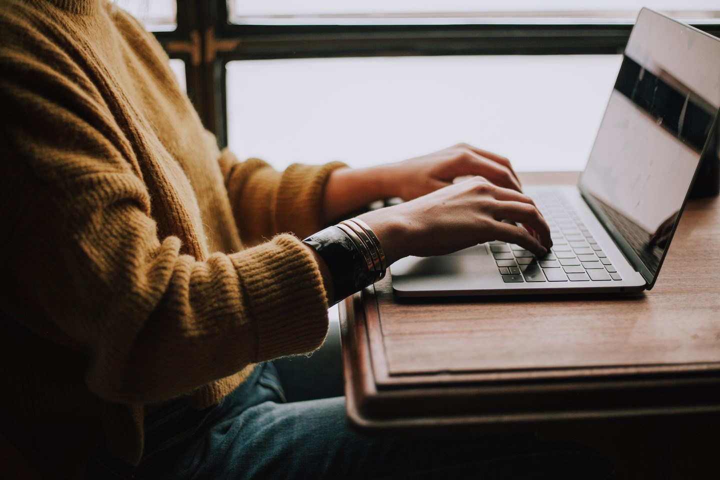 Person typing on a laptop Person typing on a laptop