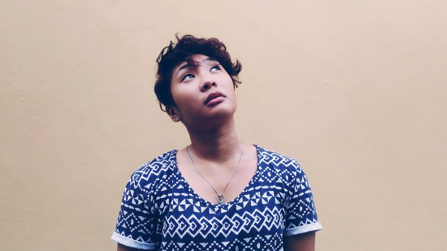 Woman looking up thoughtfully Woman looking up thoughtfully