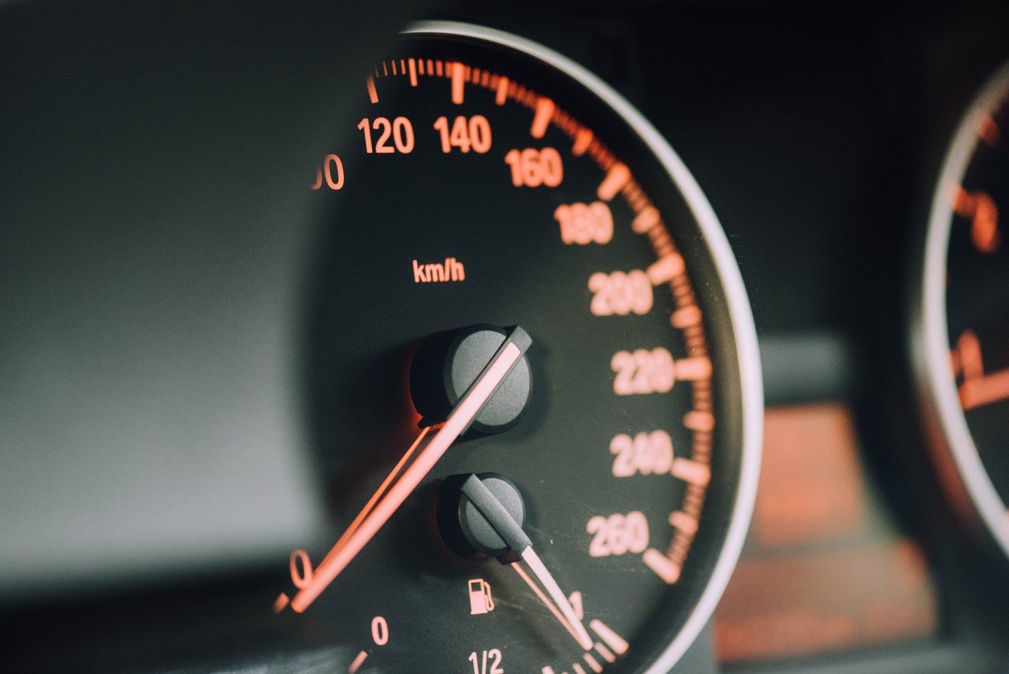 Car dashboard showing speedometer Car dashboard showing speedometer