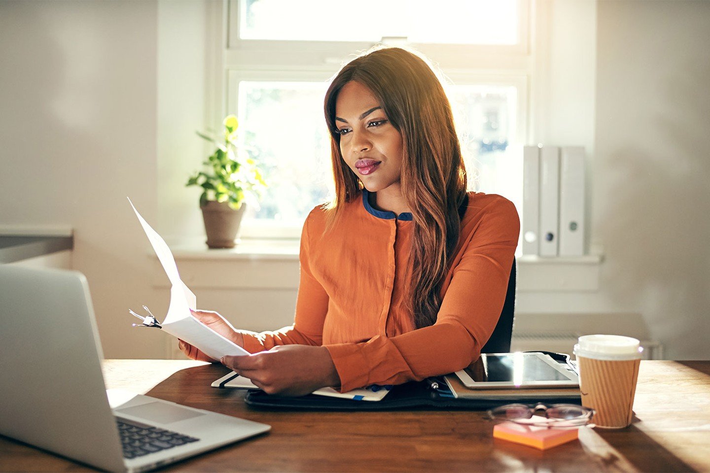 Woman looking at paperwork Woman looking at paperwork