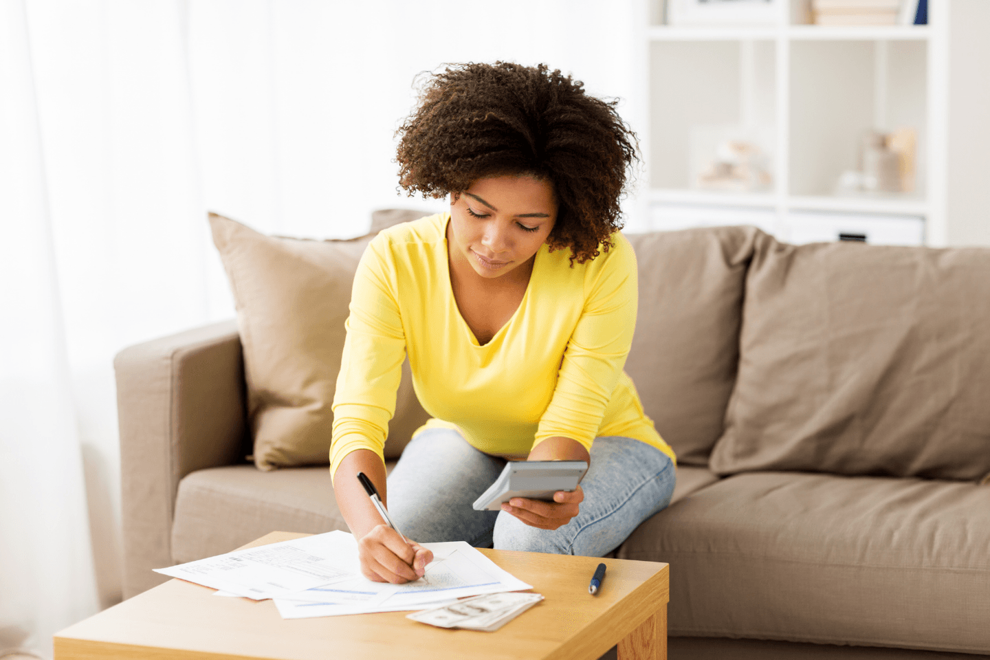 Woman doing calculations Woman doing calculations