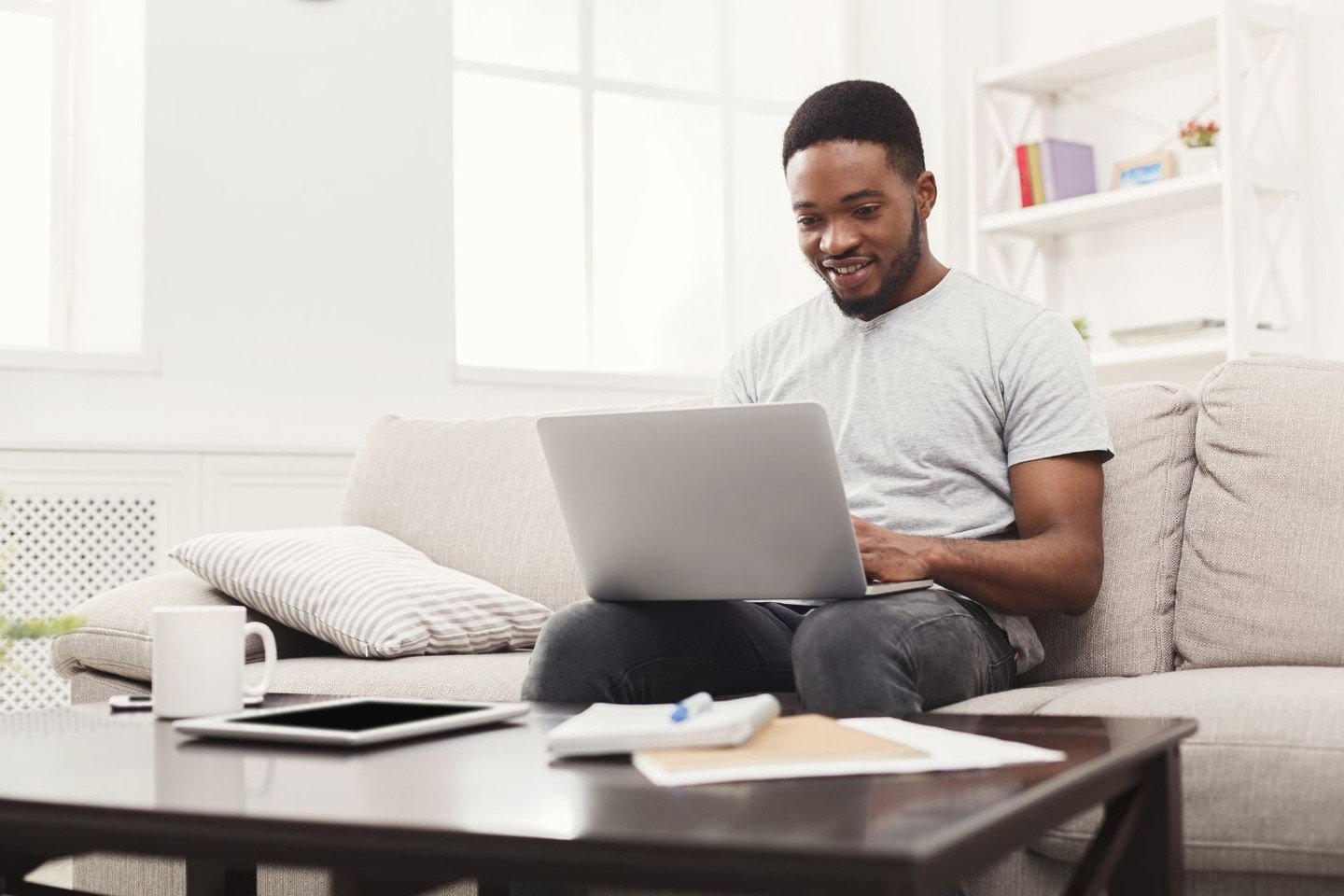 Man reads text on laptop screen Man reads text on laptop screen