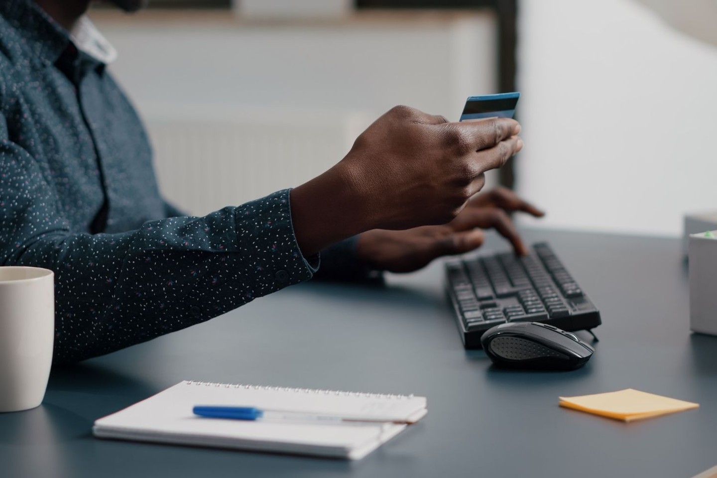 Man holding credit card Man holding credit card