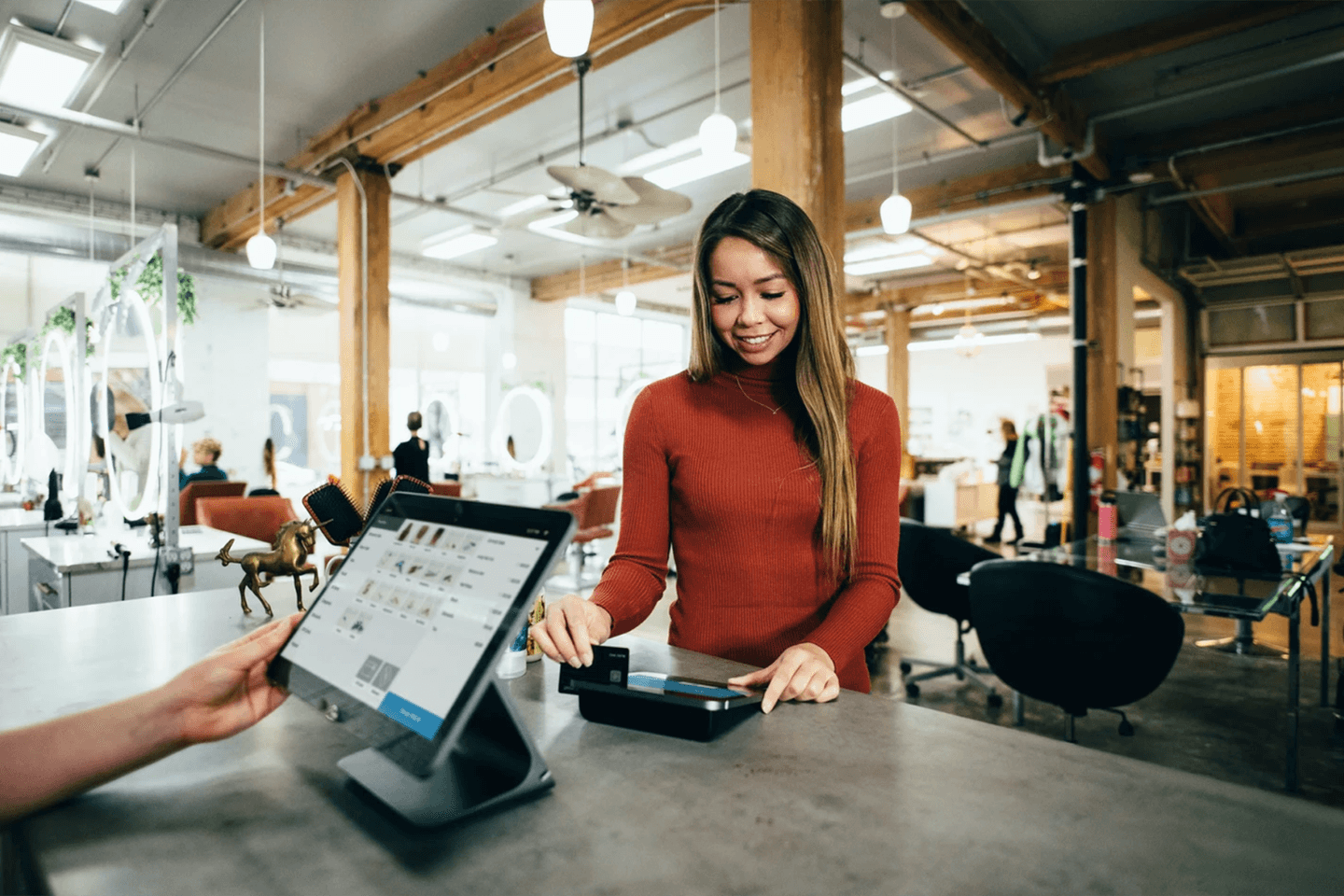 Woman paying at store Woman paying at store