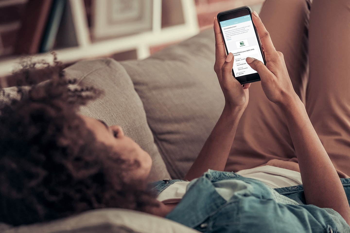 Woman looking at ClearScore offers on phone Woman looking at ClearScore offers on phone