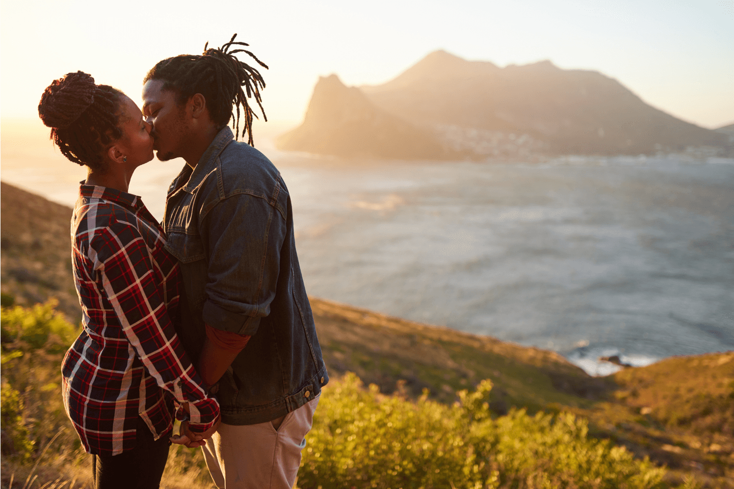 a young couple kissing each other