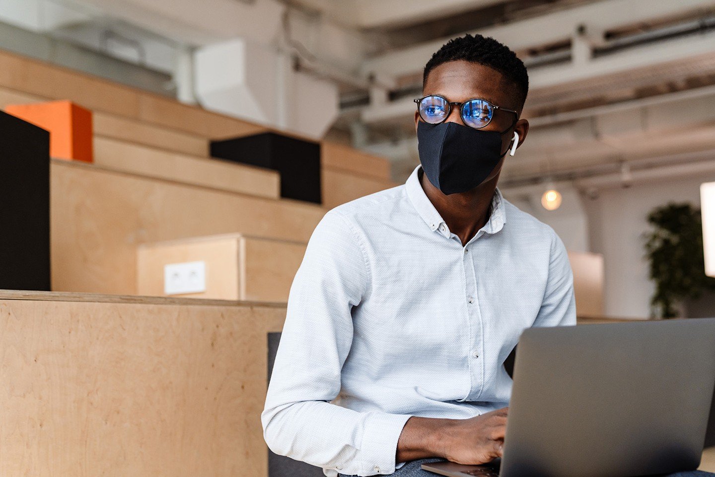 Guy with mask and laptop Guy with mask and laptop